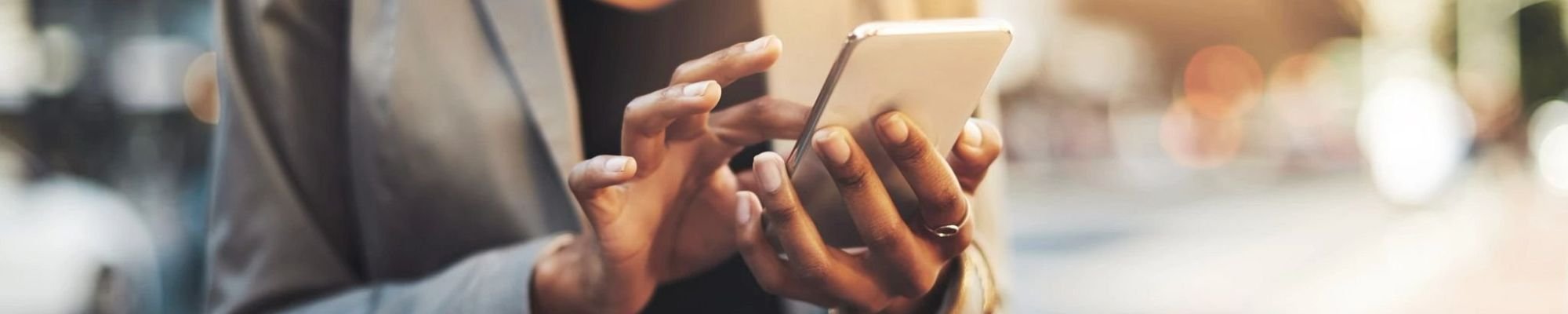 navigate on smartphone while walking on street from the Floor Store and Design in Columbia